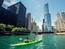 Green kayak floating down the Chicago River