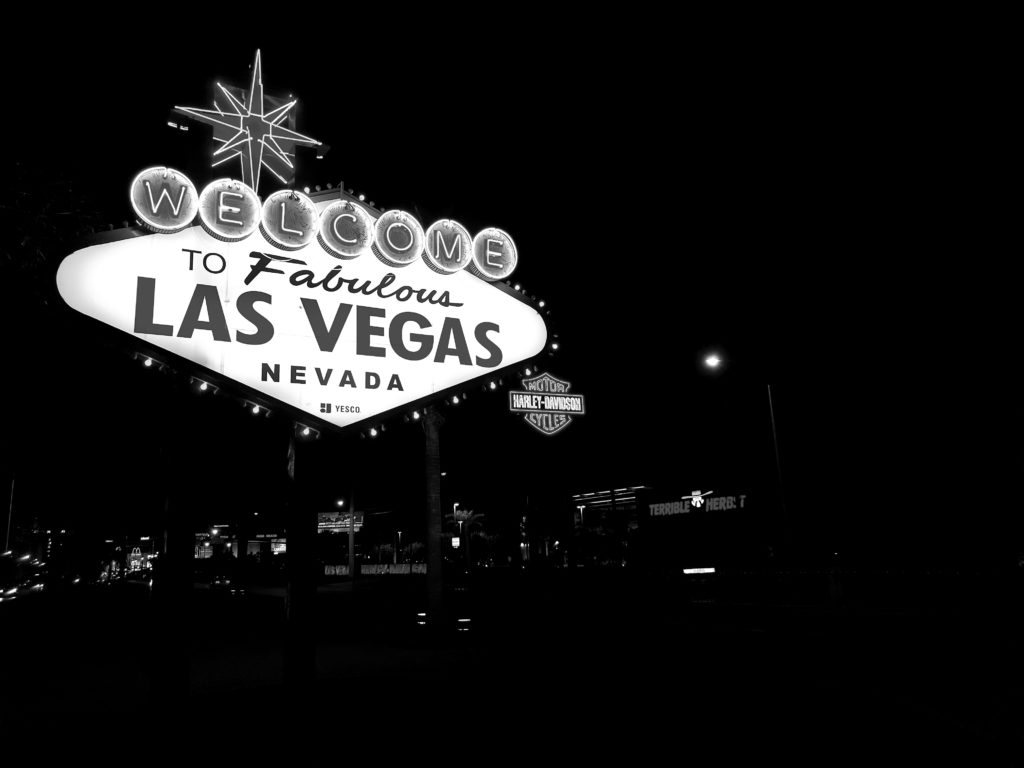 Welcome to Las Vegas sign in black and white highlighting luxury RV rentals for travelling through Vegas