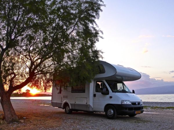 RV parked on a beach at Sunset