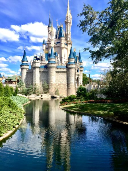 Disneyland castle on a sunny day taken from the beautiful moat.